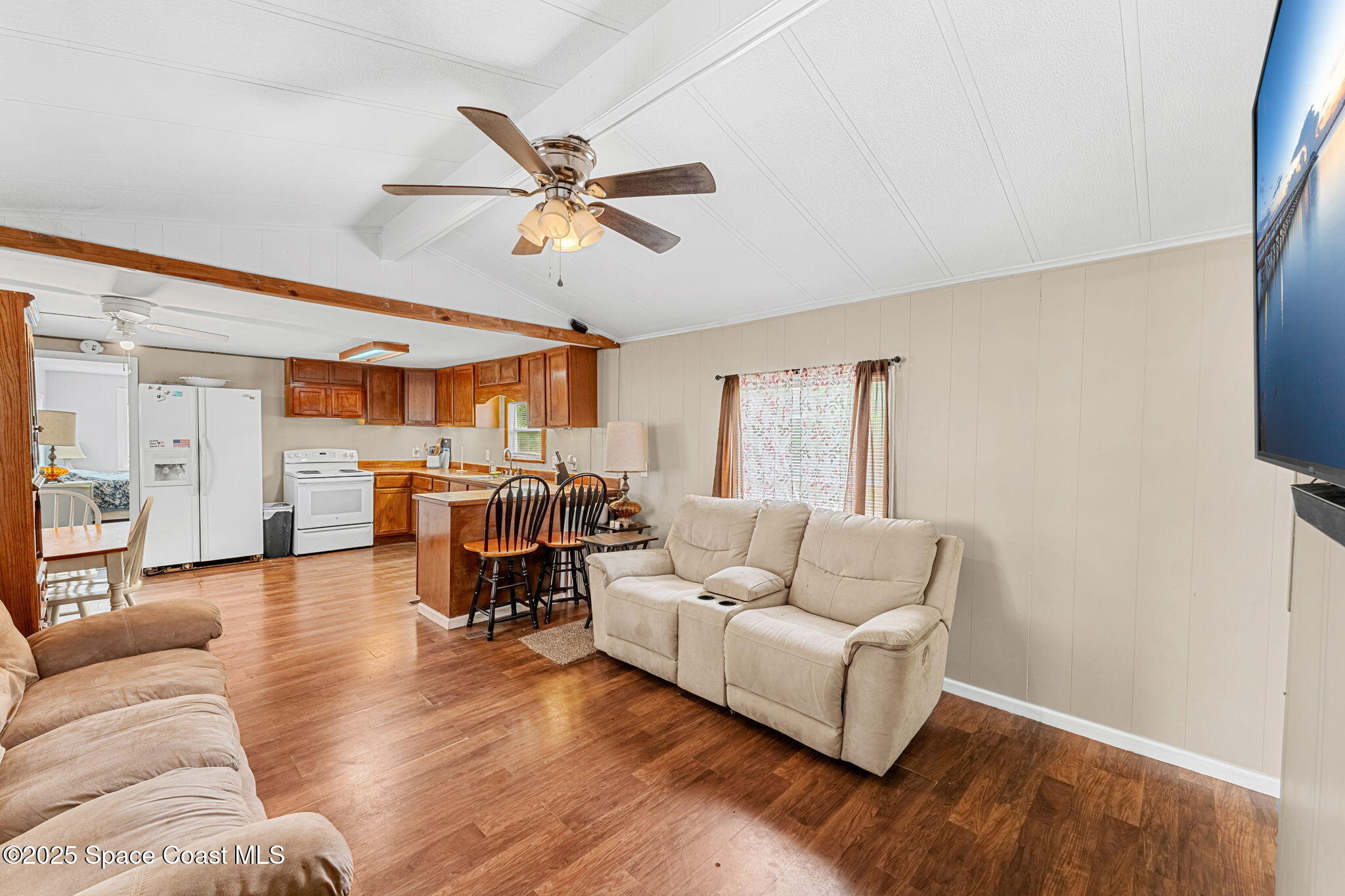 517 Bowman Boulevard Cocoa, FL 32927 - Photo 12 of 38 a living room with furniture and a large window
