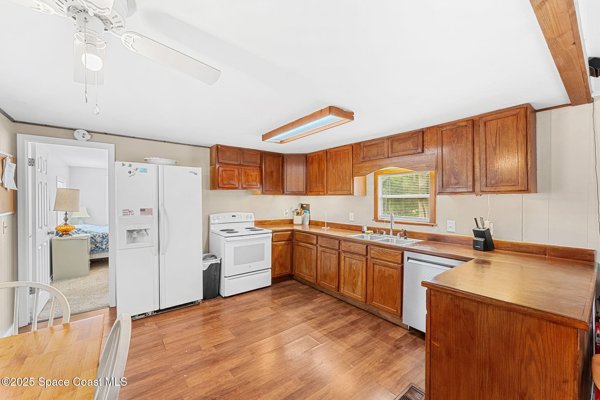 517 Bowman Boulevard Cocoa, FL 32927 - Photo 13 of 38 a kitchen with stainless steel appliances granite countertop a sink stove and refrigerator