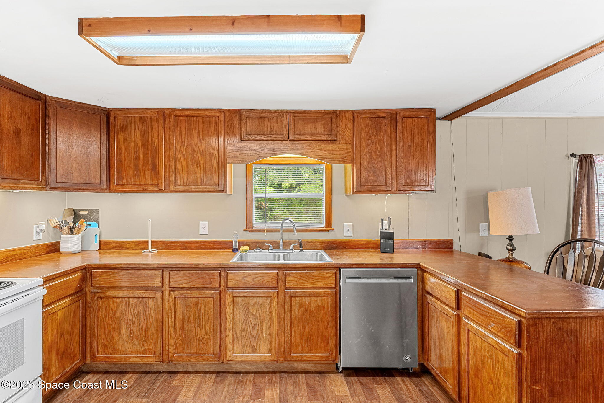 517 Bowman Boulevard Cocoa, FL 32927 - Photo 14 of 38 a kitchen with stainless steel appliances granite countertop a sink stove and cabinets