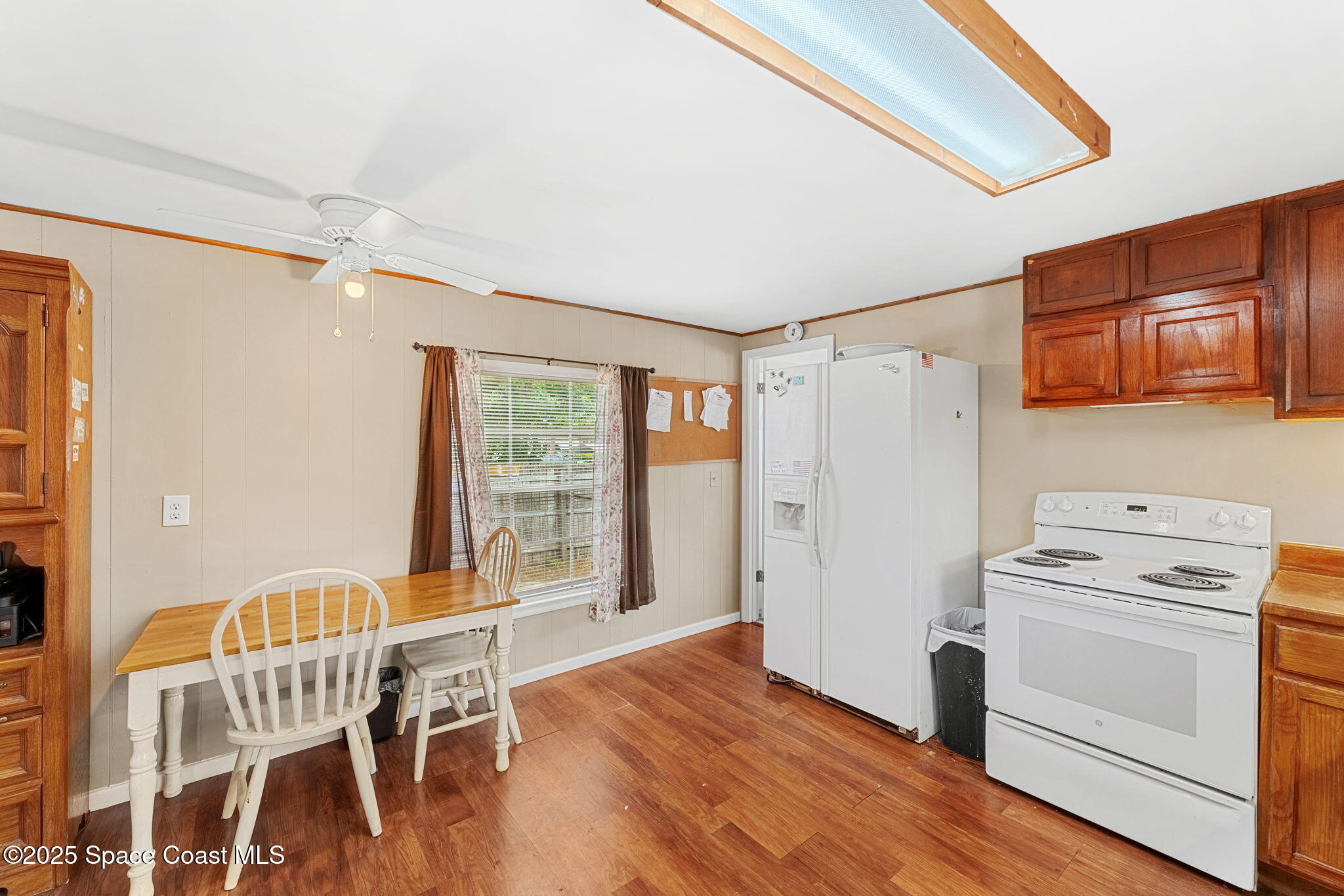 517 Bowman Boulevard Cocoa, FL 32927 - Photo 17 of 38 a view of a workspace with furniture and wooden floor