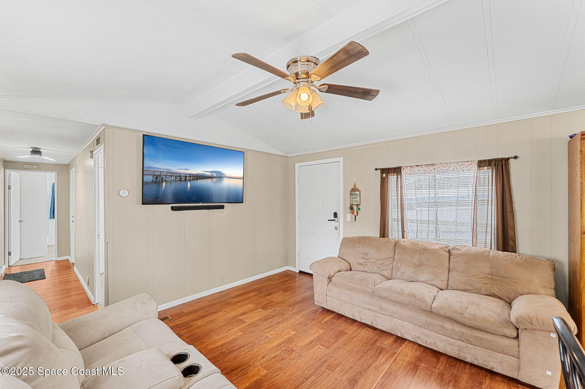 517 Bowman Boulevard Cocoa, FL 32927 - Photo 19 of 38 a living room with furniture and a ceiling fan