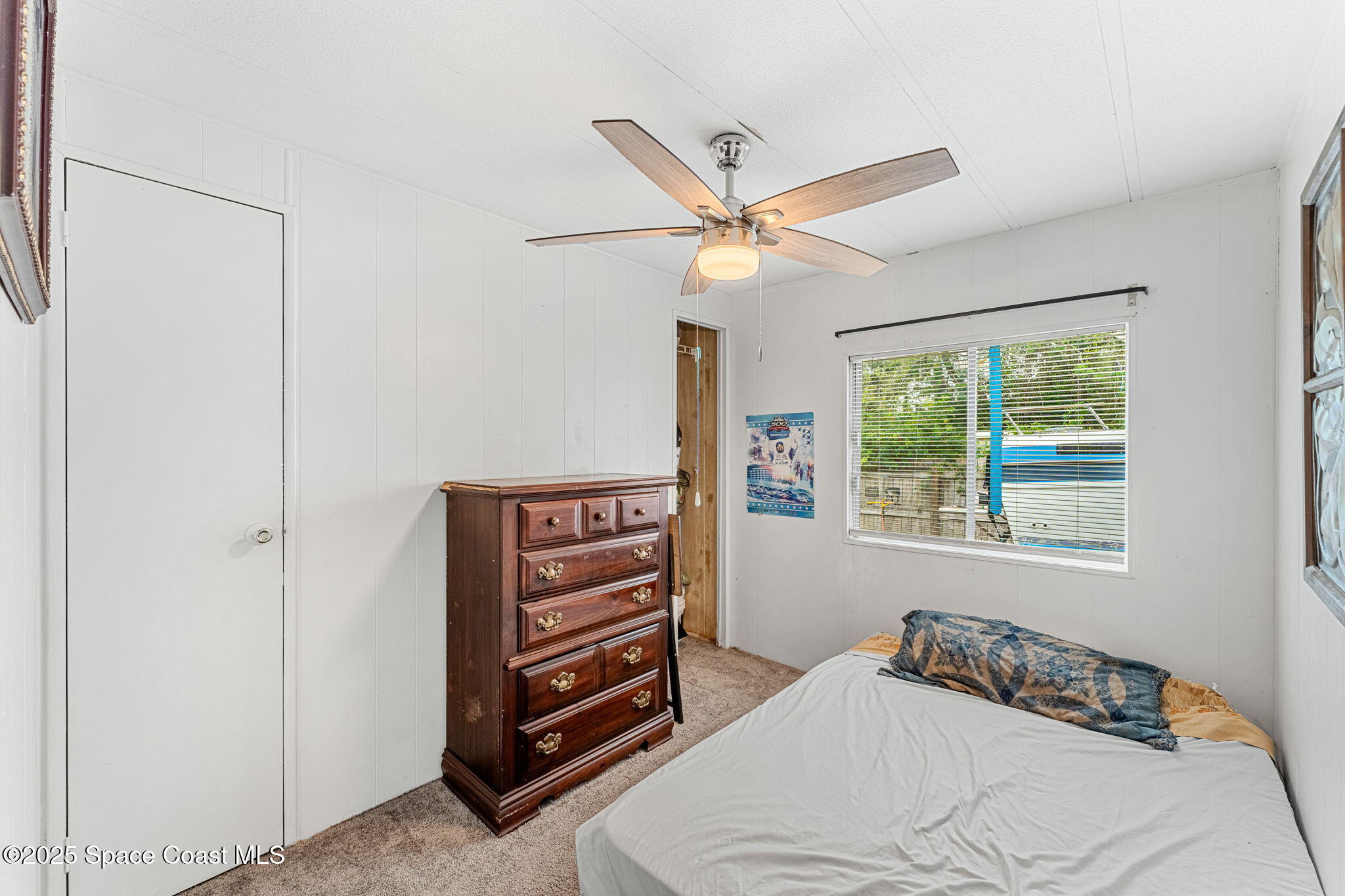 517 Bowman Boulevard Cocoa, FL 32927 - Photo 22 of 38 a bedroom with a bed and a window
