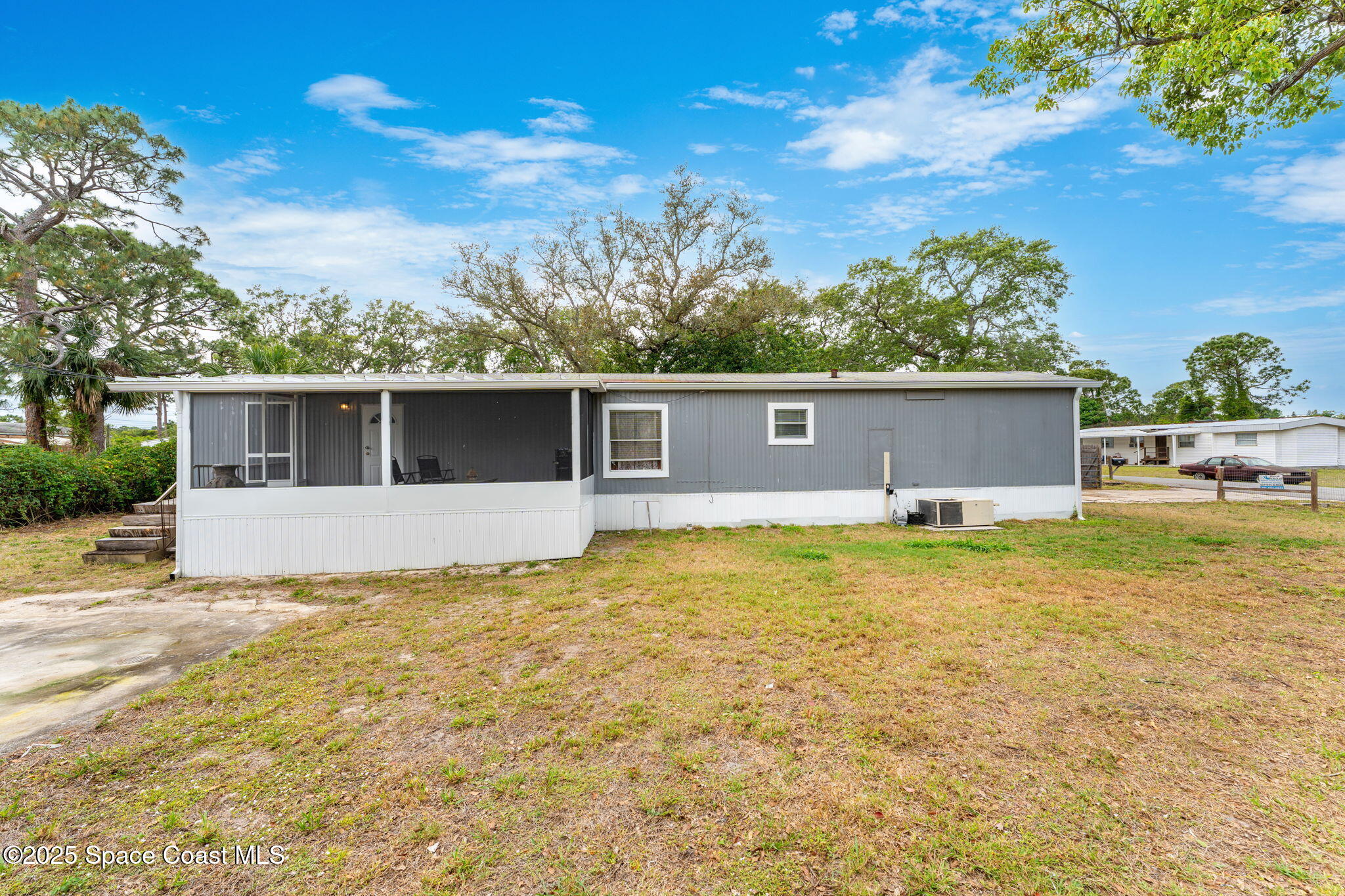 517 Bowman Boulevard Cocoa, FL 32927 - Photo 26 of 38 a view of house with outdoor space and sitting area