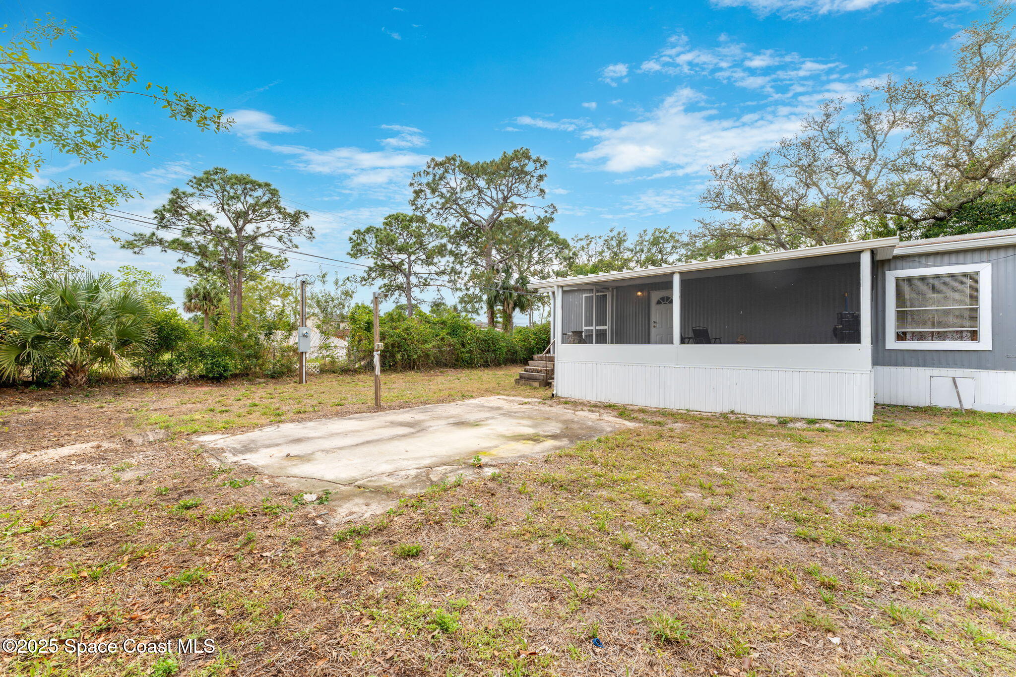 517 Bowman Boulevard Cocoa, FL 32927 - Photo 27 of 38 a view of a house with a yard