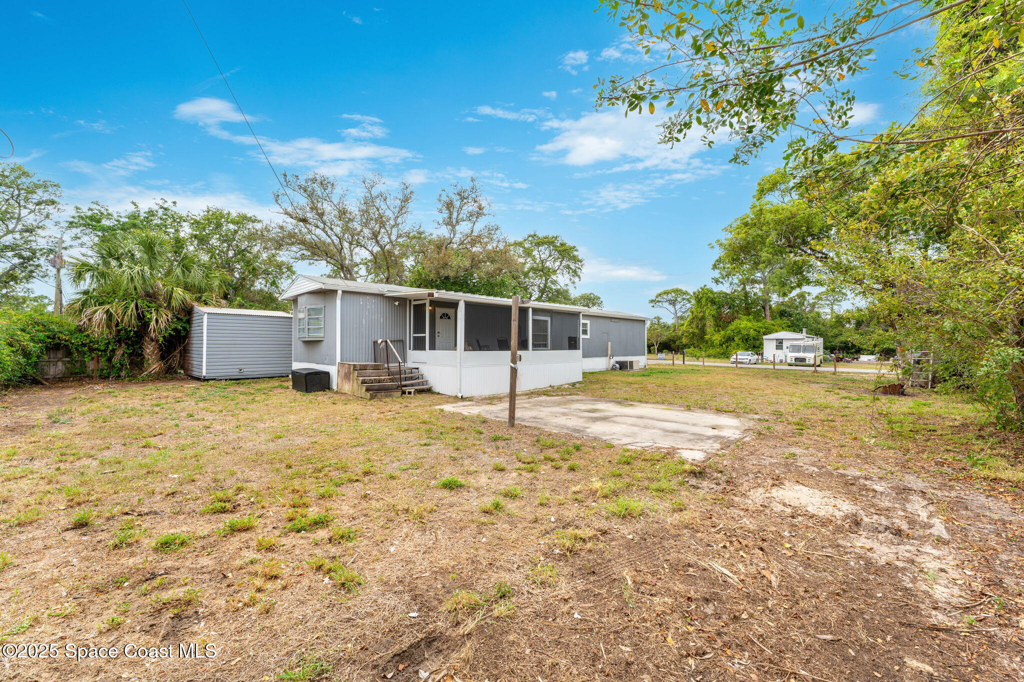 517 Bowman Boulevard Cocoa, FL 32927 - Photo 29 of 38 a backyard of a house with table and chairs