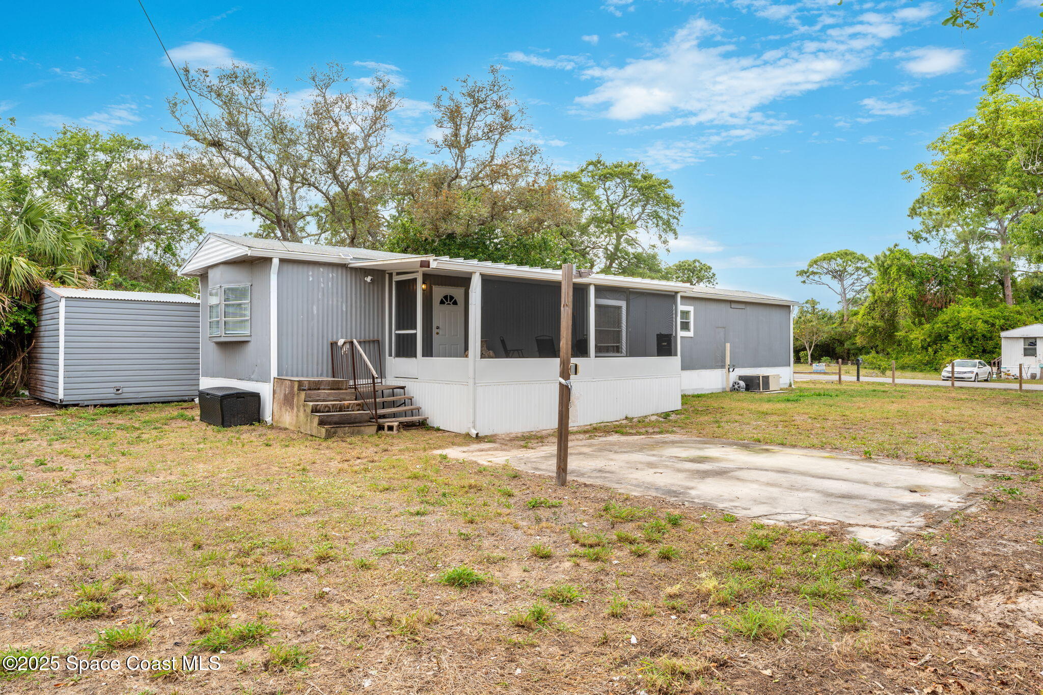 517 Bowman Boulevard Cocoa, FL 32927 - Photo 30 of 38 a view of a house with backyard and a tree