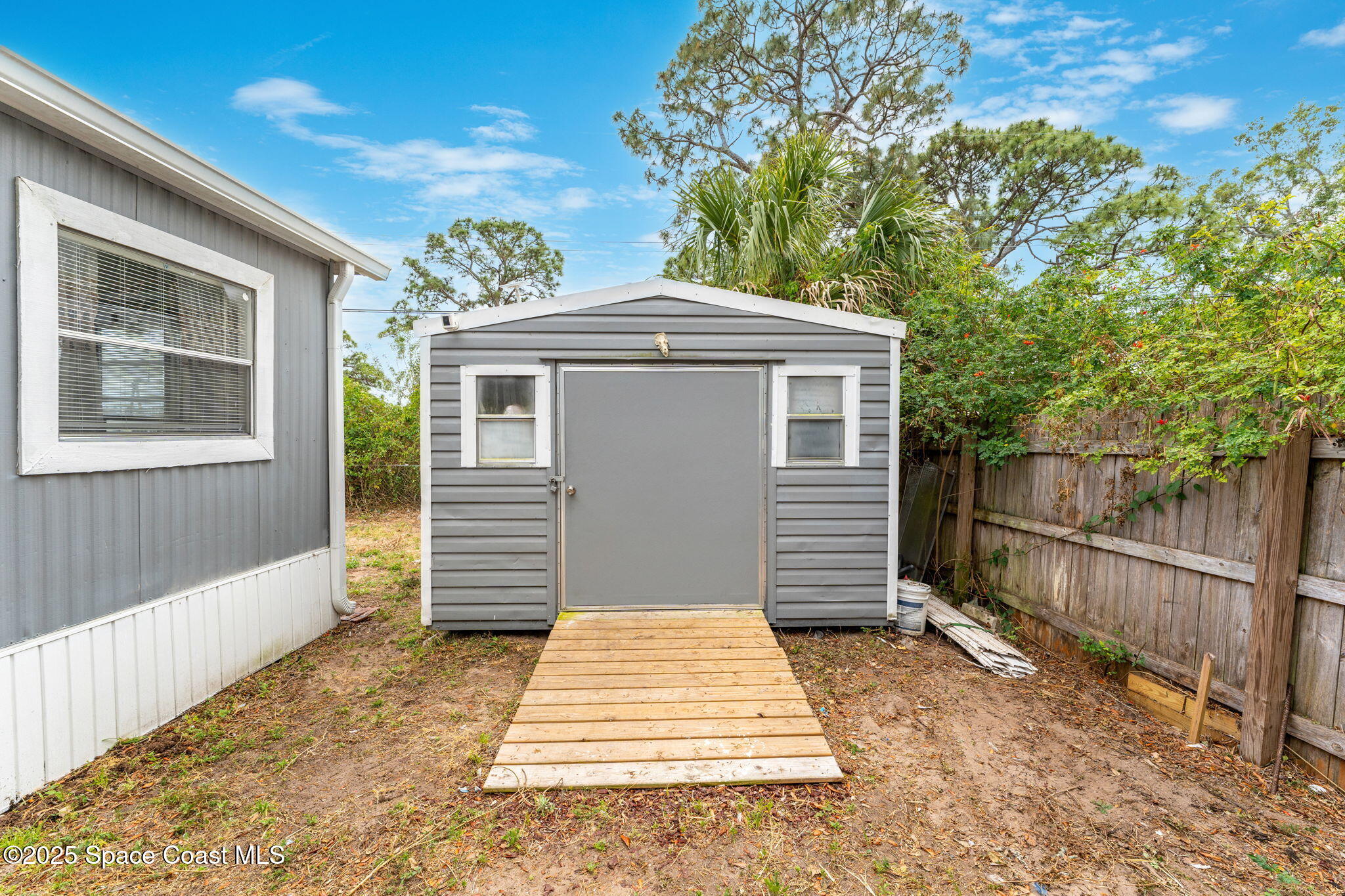 517 Bowman Boulevard Cocoa, FL 32927 - Photo 32 of 38 a front view of a house with a yard