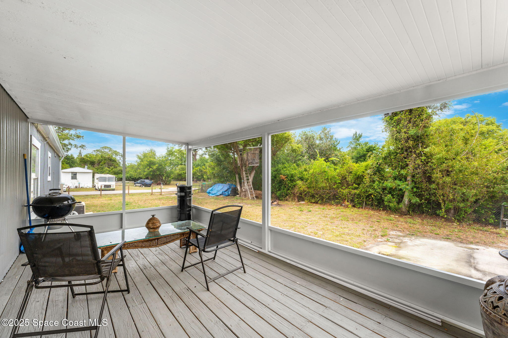 517 Bowman Boulevard Cocoa, FL 32927 - Photo 4 of 38 a view of a room with wooden floor and outdoor space