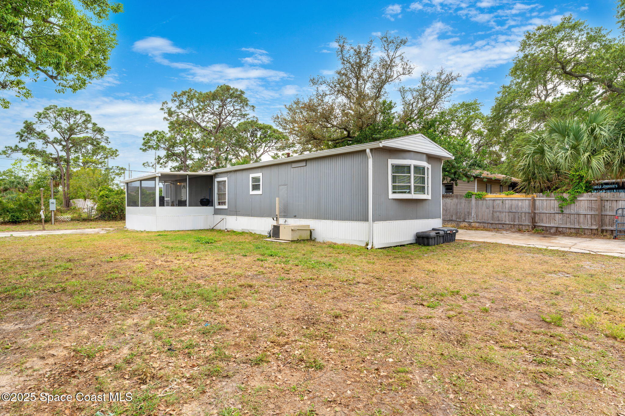 517 Bowman Boulevard Cocoa, FL 32927 - Photo 9 of 38 a backyard of a house with table and chairs