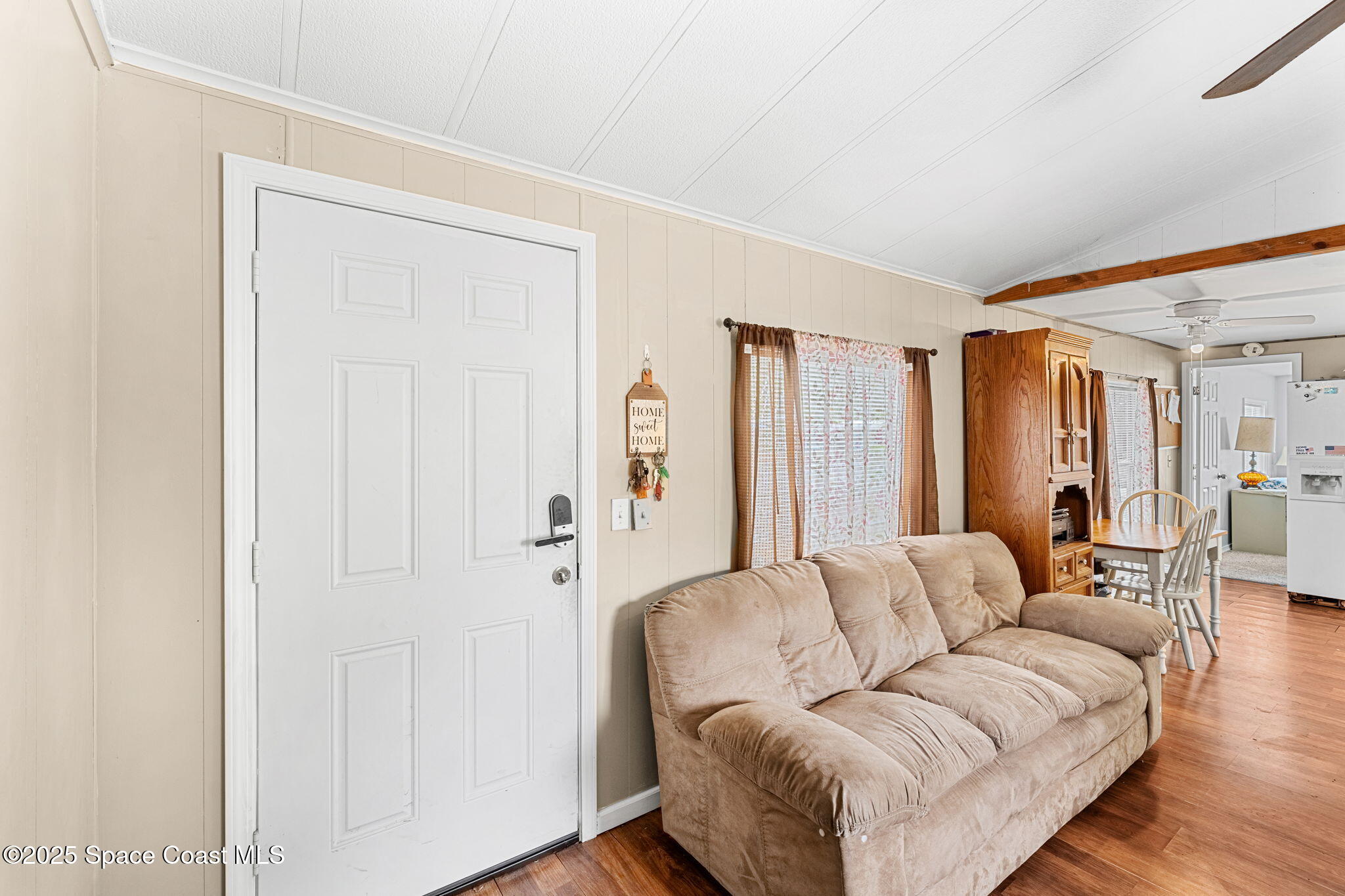 517 Bowman Boulevard Cocoa, FL 32927 - Photo 10 of 38 a living room with furniture and a wooden floor