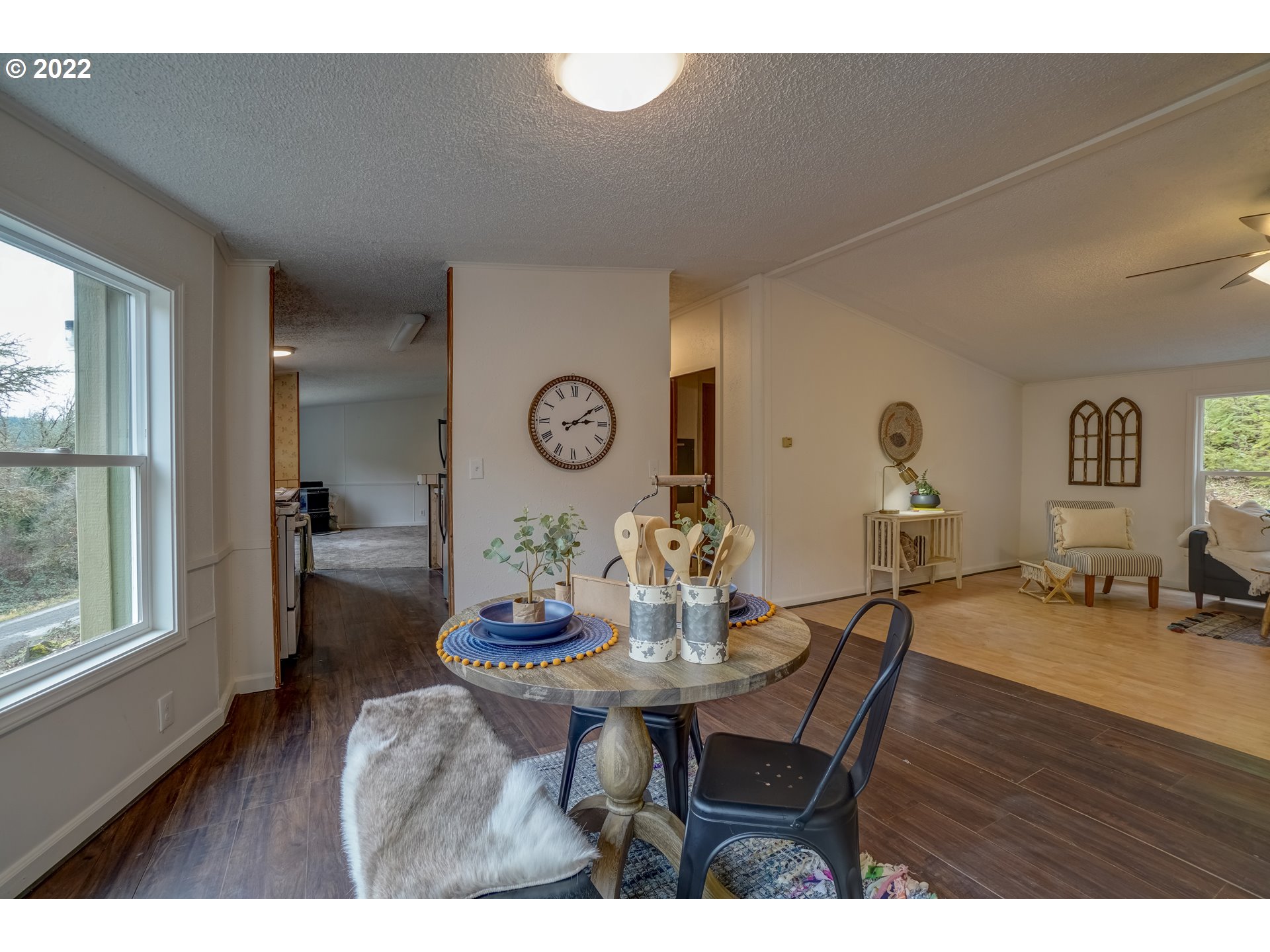 6967 Southwest Mill Road Gaston, OR 97119 - Photo 6 of 28 a view of a dining room with furniture and wooden floor
