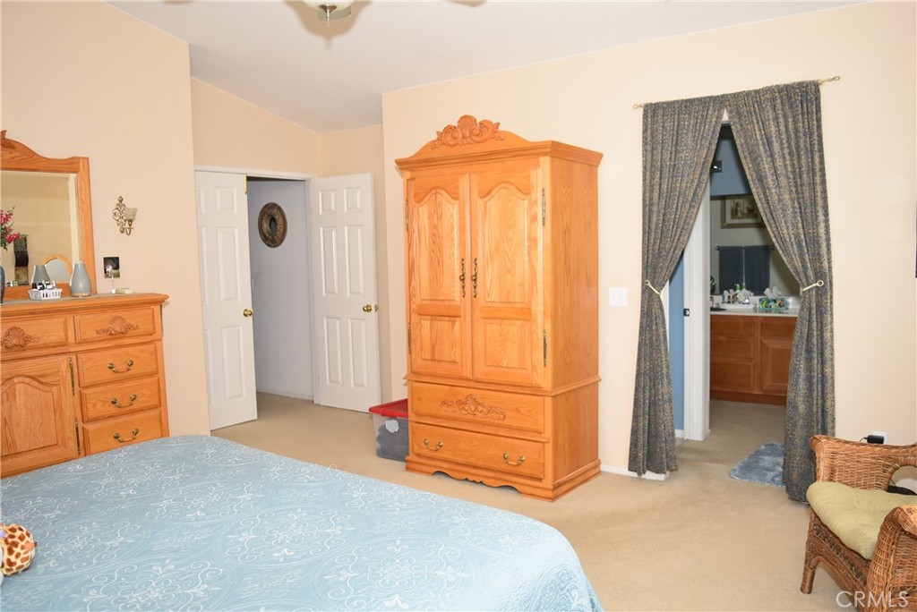 1665 Ravenswood Road Beaumont, CA 92223 - Photo 25 of 41 a bedroom with a bed and a dresser