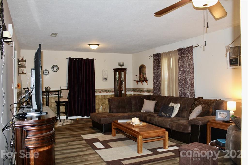 2411 Poors Ford Road Rutherfordton, NC 28139 - Photo 2 of 19 a living room with furniture and a flat screen tv