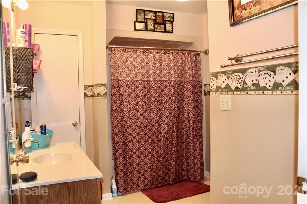 2411 Poors Ford Road Rutherfordton, NC 28139 - Photo 12 of 19 a bathroom with a sink and a shower curtain