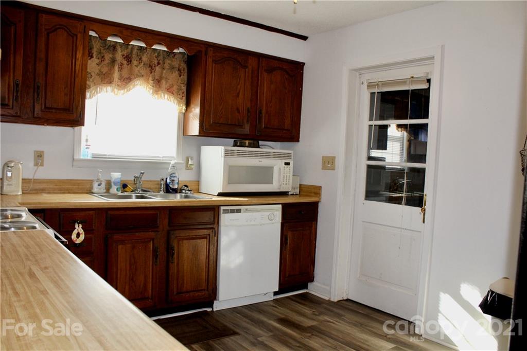 2411 Poors Ford Road Rutherfordton, NC 28139 - Photo 6 of 19 a kitchen with a refrigerator and a sink