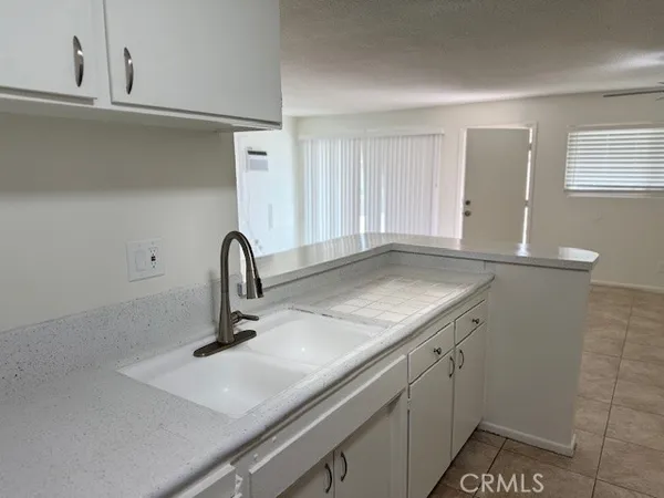 a close view of a sink and a vanity in the bathroom