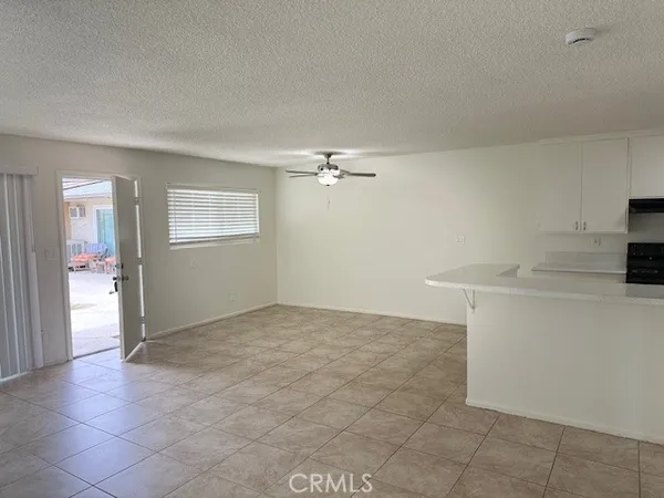 a view of an empty room and fire place