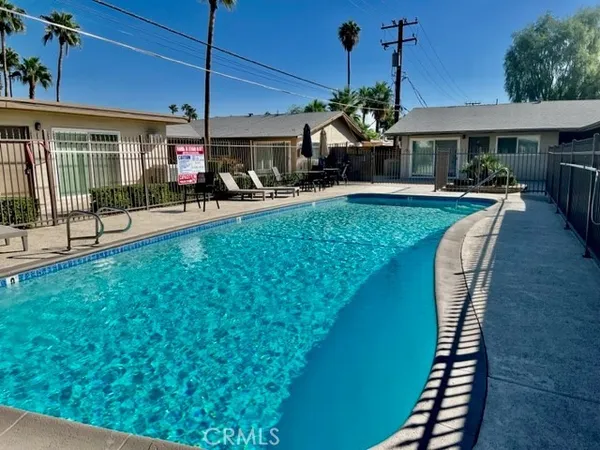 a view of a swimming pool with a deck