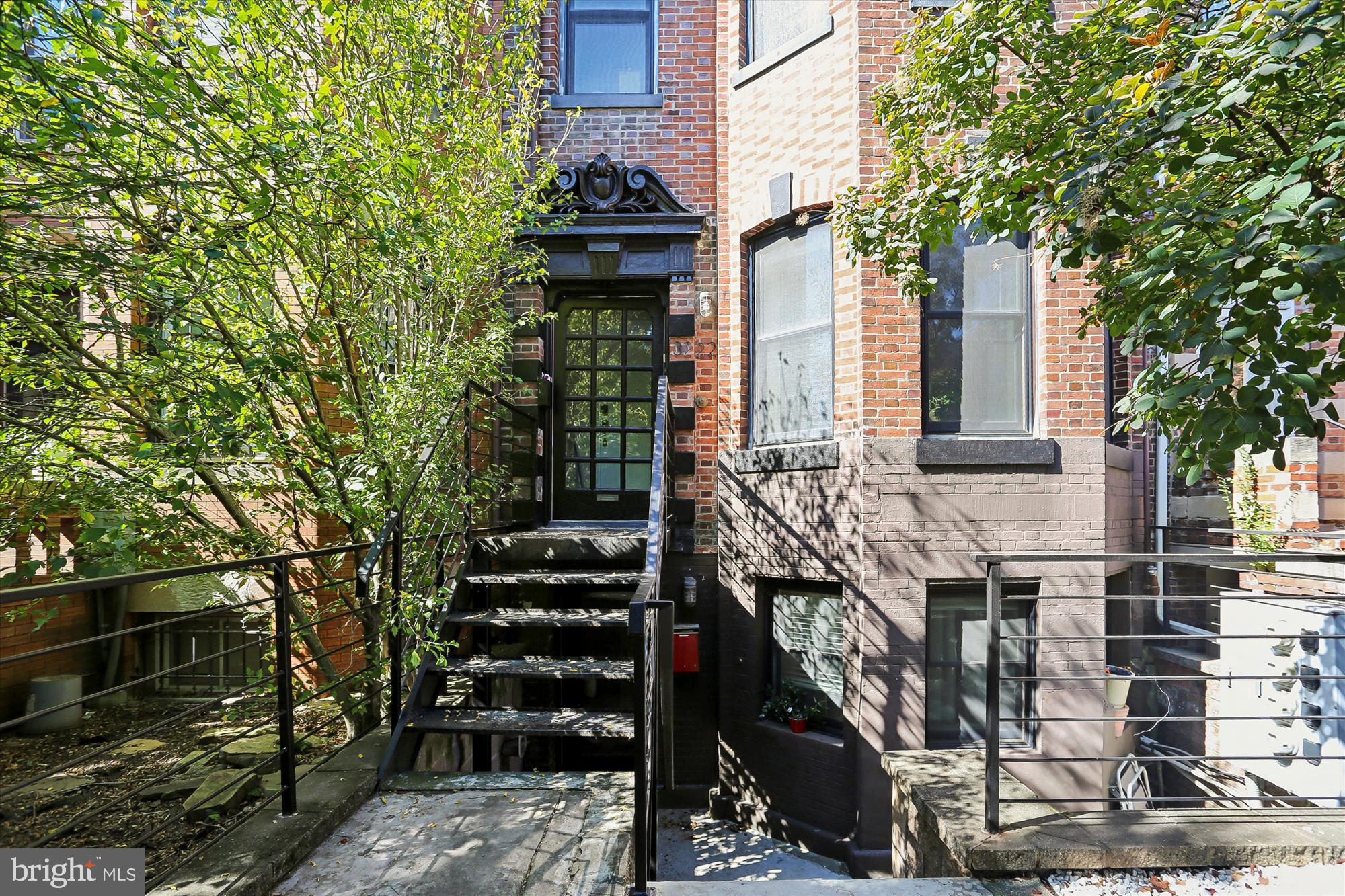 3222 13th Street Northwest, Unit 2 Washington, DC 20010 - Photo 2 of 52 a front view of a house with street