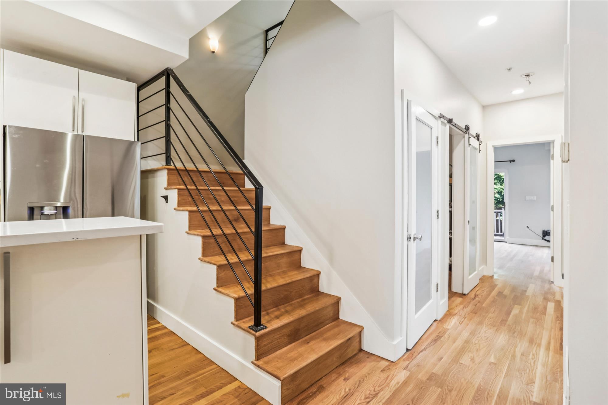3222 13th Street Northwest, Unit 2 Washington, DC 20010 - Photo 22 of 52 a view of a hallway with wooden floor and staircase