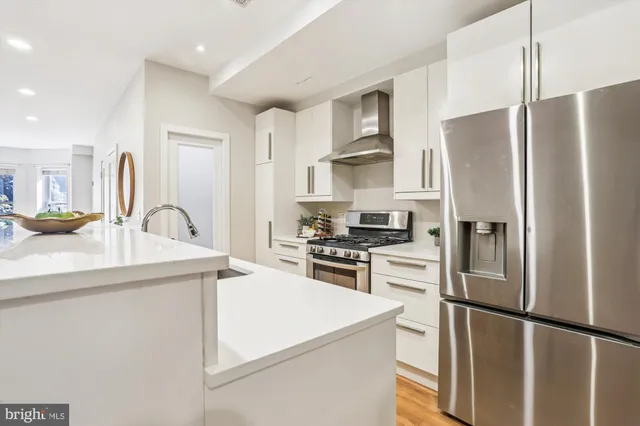 a kitchen that has a sink and a stove