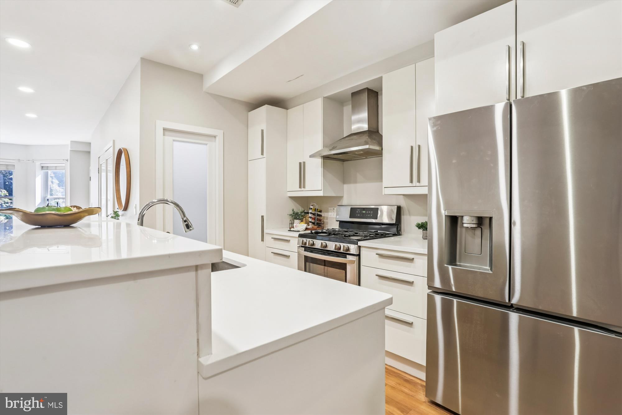 3222 13th Street Northwest, Unit 2 Washington, DC 20010 - Photo 23 of 52 a kitchen with stainless steel appliances a refrigerator sink and stove
