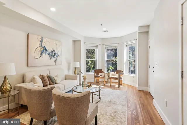 a living room with furniture and a table