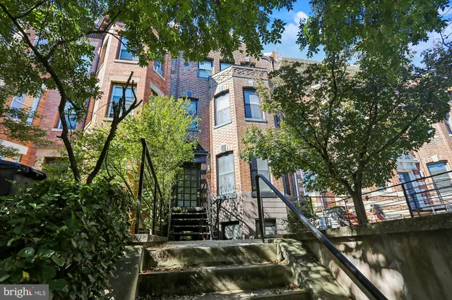 a view of a backyard from a balcony