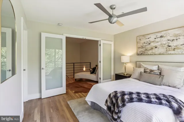 a bedroom with a large bed and a window