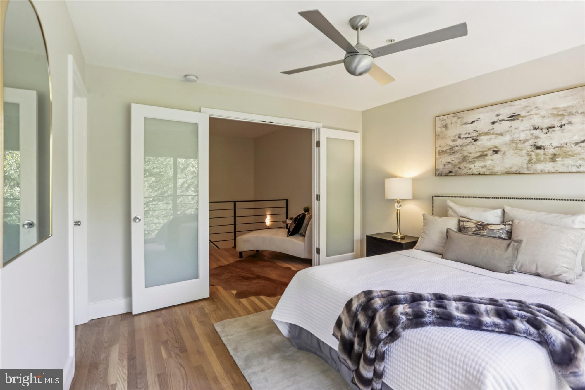 3222 13th Street Northwest, Unit 2 Washington, DC 20010 - Photo 46 of 52 a bedroom with a large bed and a chandelier