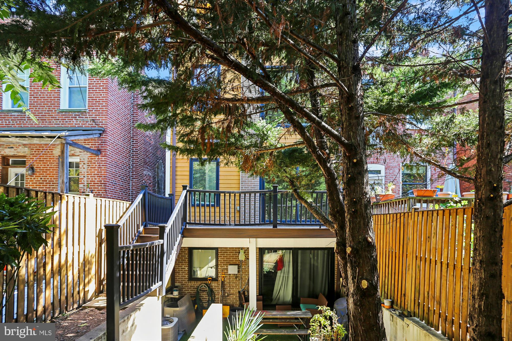 3222 13th Street Northwest, Unit 2 Washington, DC 20010 - Photo 5 of 52 a front view of a house with a tree