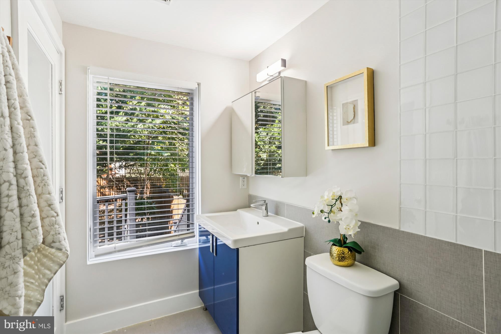 3222 13th Street Northwest, Unit 2 Washington, DC 20010 - Photo 10 of 52 a bathroom with a toilet sink and mirror