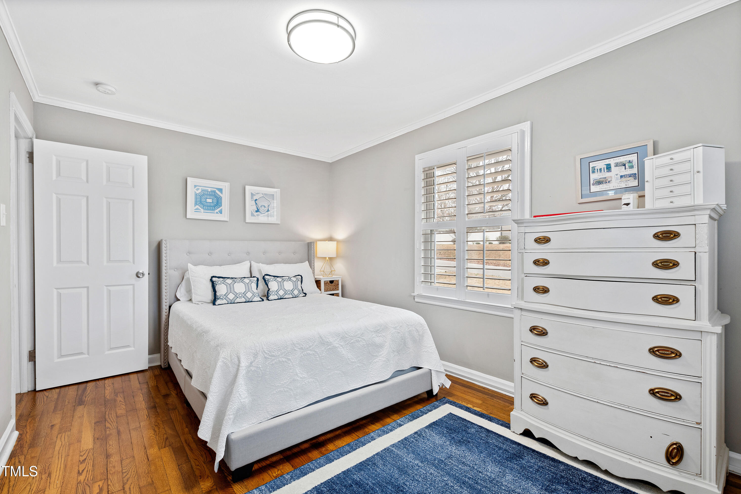 1817 Rankin Street Raleigh, NC 27604 - Photo 18 of 31 a bedroom with a bed and a window