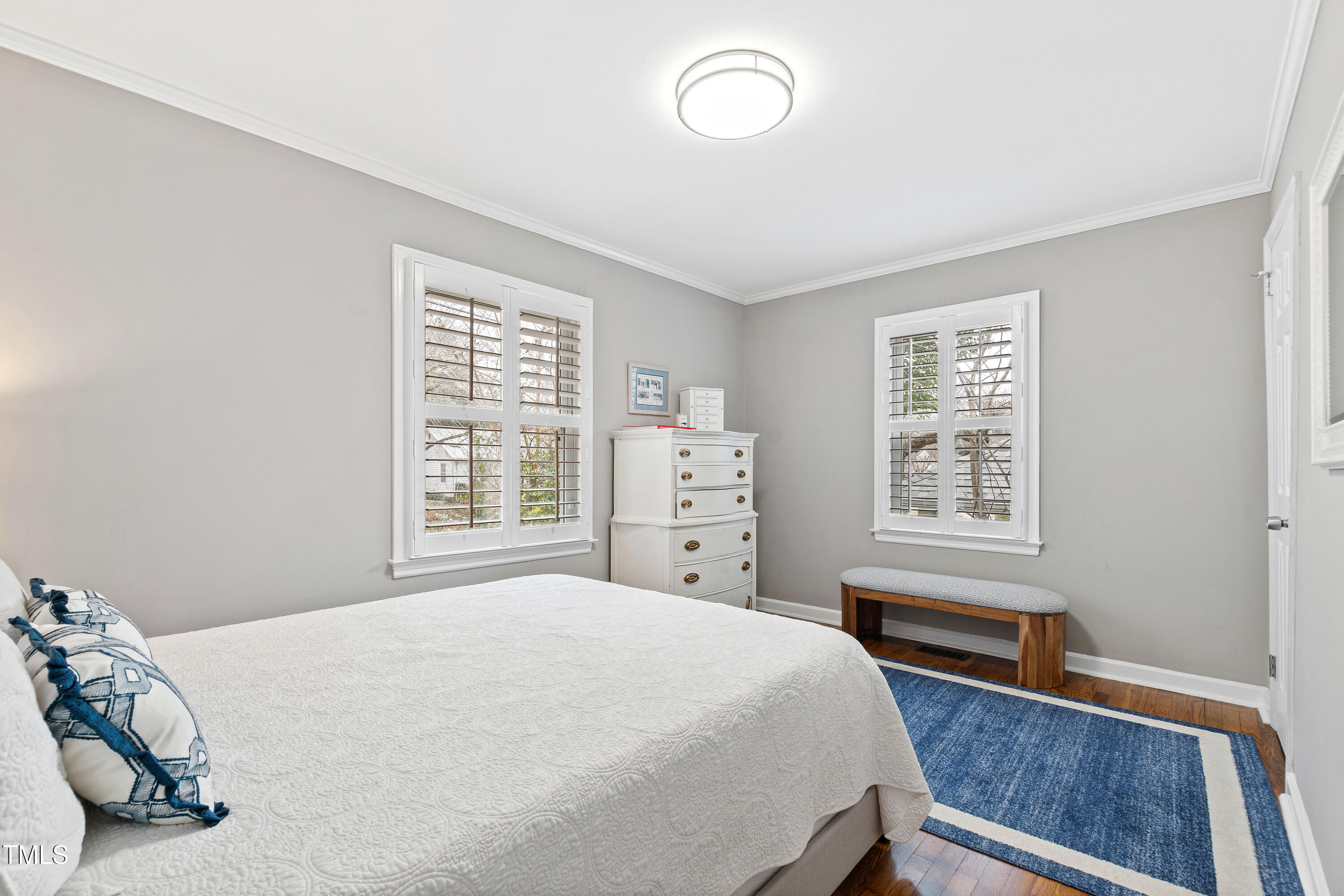 1817 Rankin Street Raleigh, NC 27604 - Photo 19 of 31 a bedroom with a bed and a window