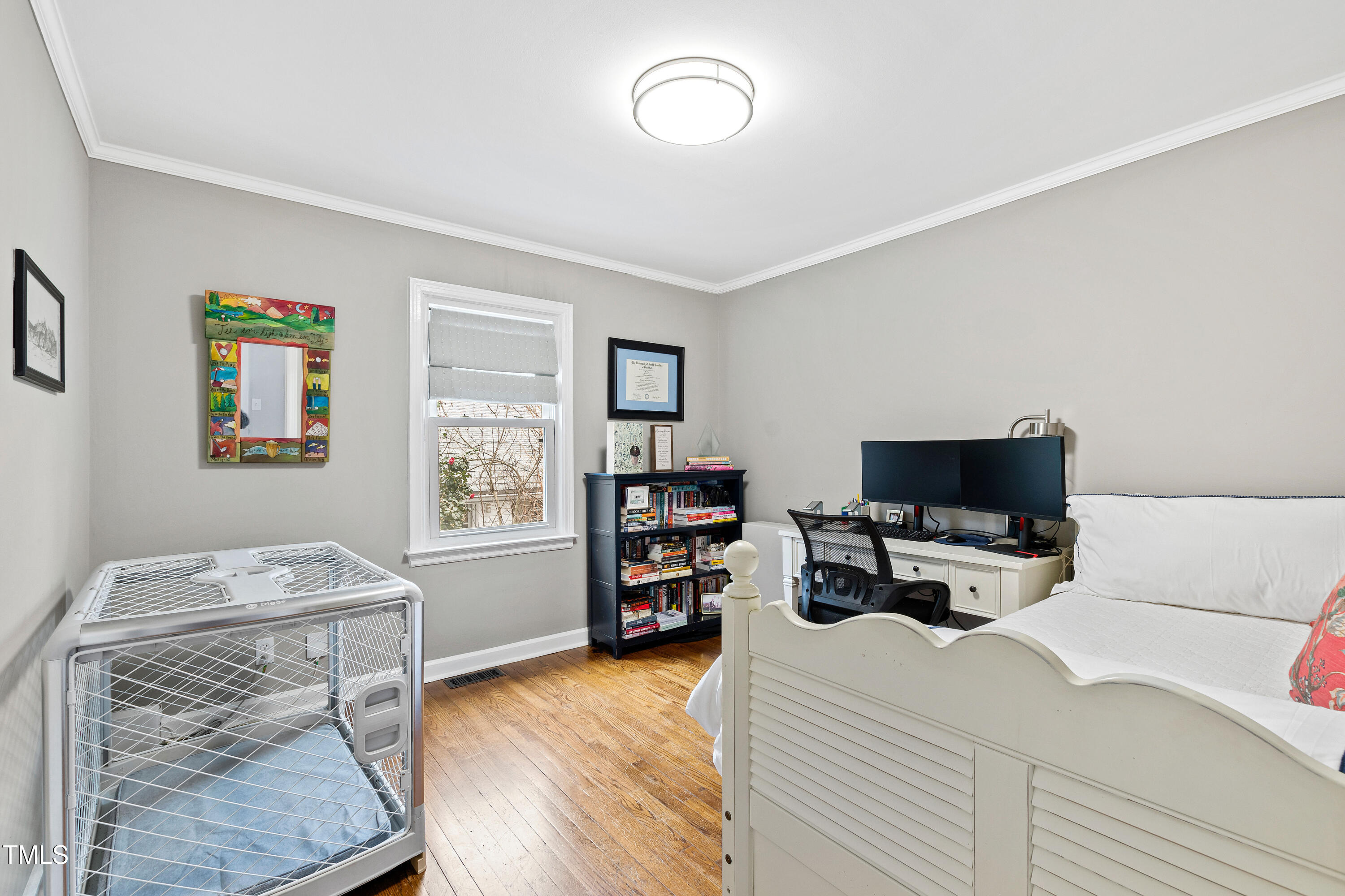 1817 Rankin Street Raleigh, NC 27604 - Photo 22 of 31 a bedroom with a bed and furniture