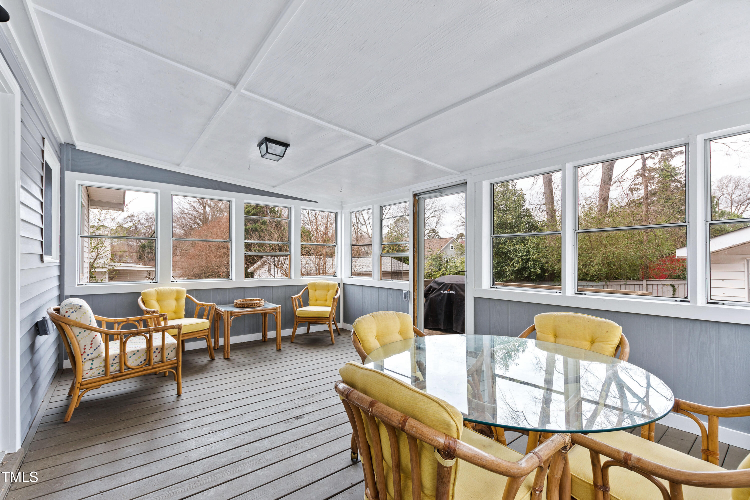 1817 Rankin Street Raleigh, NC 27604 - Photo 23 of 31 a living room with furniture and floor to ceiling windows