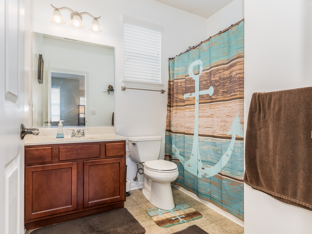 1927 Chase Lane, Unit 1927 Aurora, IL 60502 - Photo 16 of 24 a bathroom with a sink toilet and shower