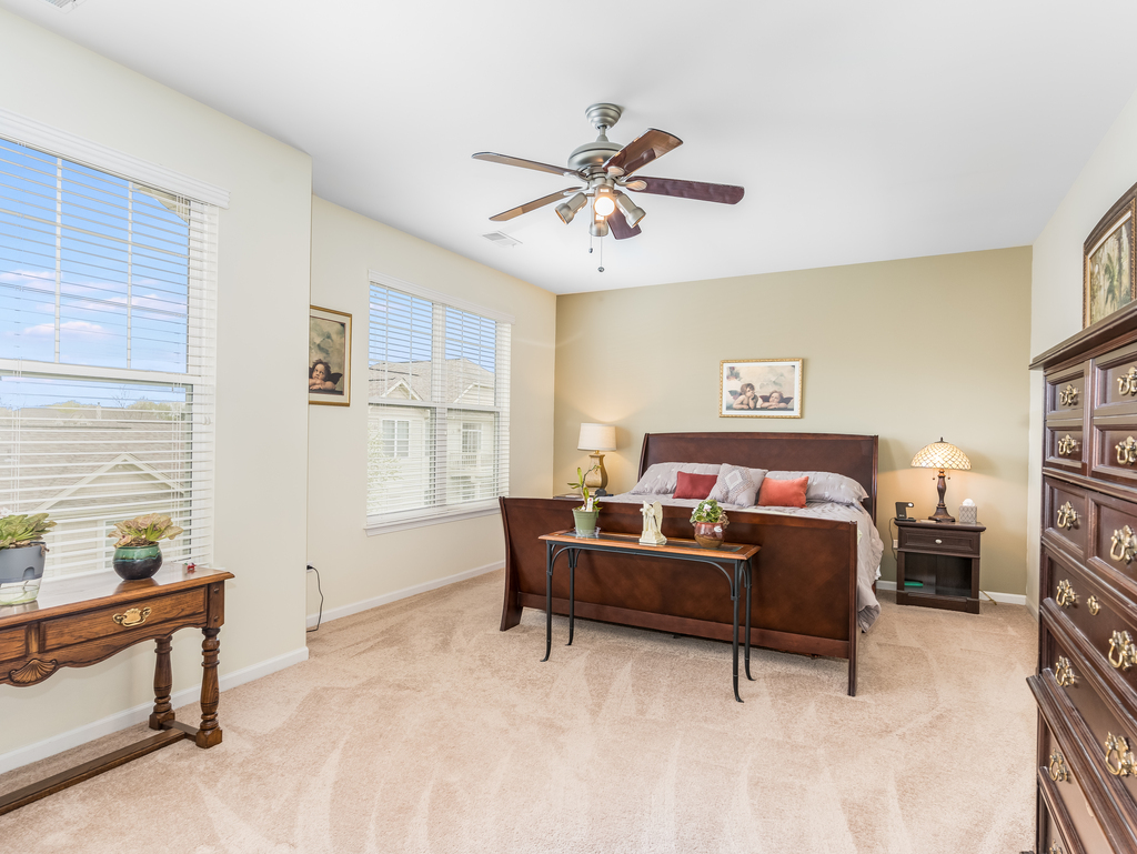 1927 Chase Lane, Unit 1927 Aurora, IL 60502 - Photo 19 of 24 a bedroom with furniture and a window