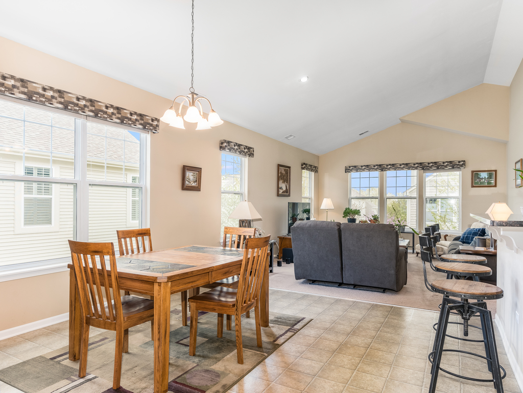 1927 Chase Lane, Unit 1927 Aurora, IL 60502 - Photo 9 of 24 a dining room with furniture and window