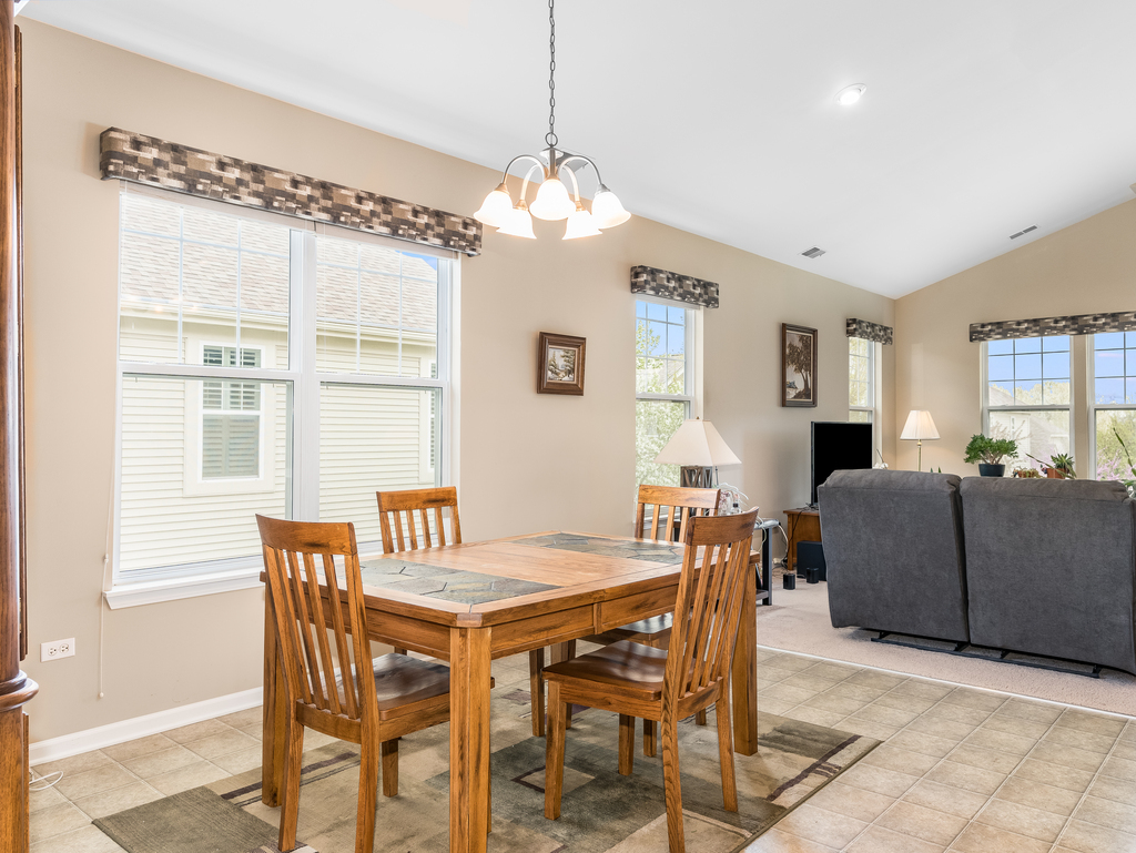 1927 Chase Lane, Unit 1927 Aurora, IL 60502 - Photo 10 of 24 a dining room with furniture and window