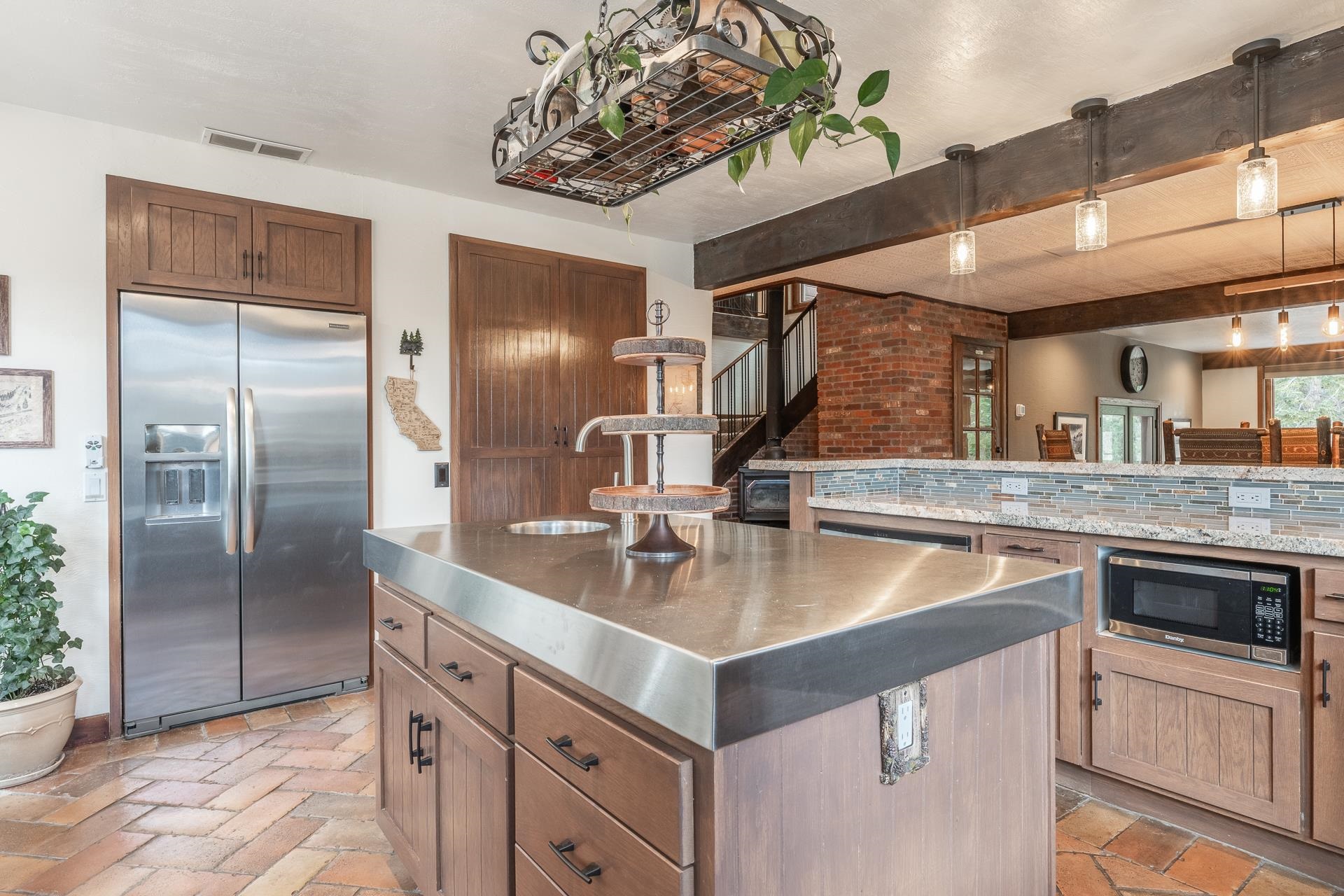 139 Ridgecrest Drive Mammoth Lakes, CA 93546 - Photo 17 of 65 Kitchen island with a stainless steel countertop and integrated sink