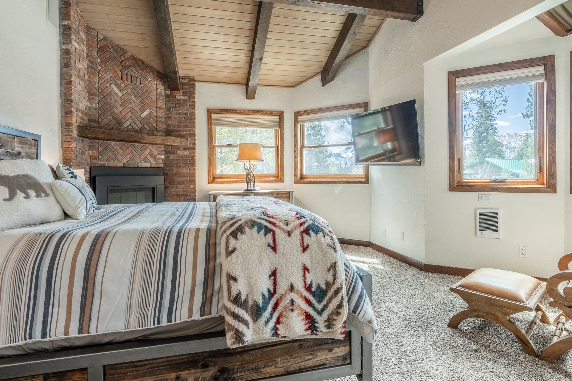 139 Ridgecrest Drive Mammoth Lakes, CA 93546 - Photo 29 of 65 Brick gas log fireplace with a substantial timber mantle