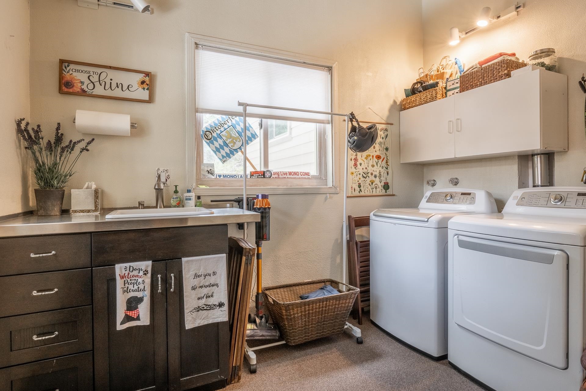 139 Ridgecrest Drive Mammoth Lakes, CA 93546 - Photo 53 of 65 Dedicated laundry space featuring a utility sink with a stainless steel countertop and garage access