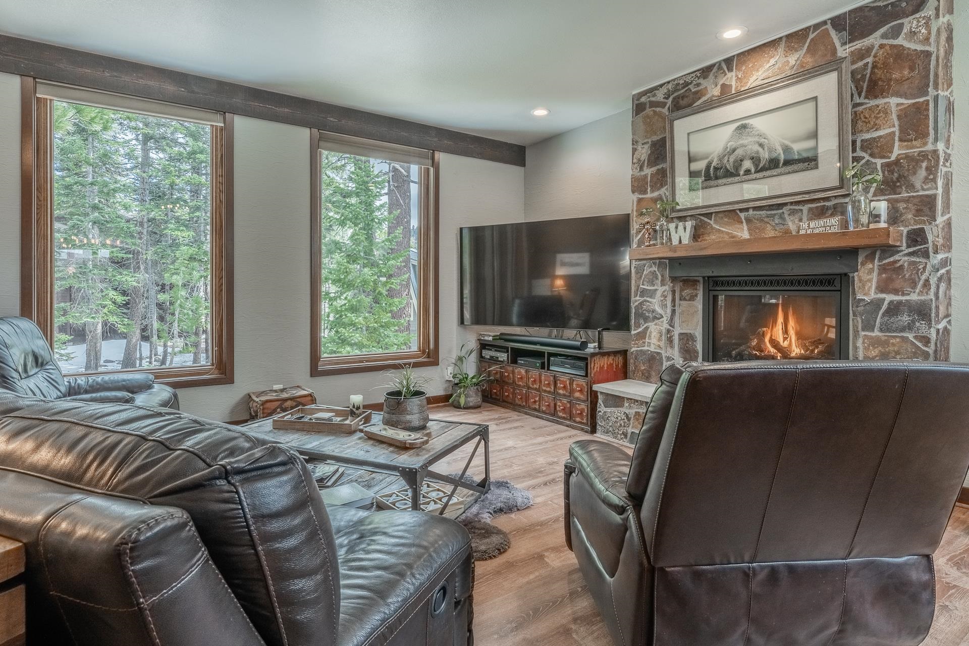 139 Ridgecrest Drive Mammoth Lakes, CA 93546 - Photo 6 of 65 Stone-clad fireplace featuring a dark wood mantel and hearth