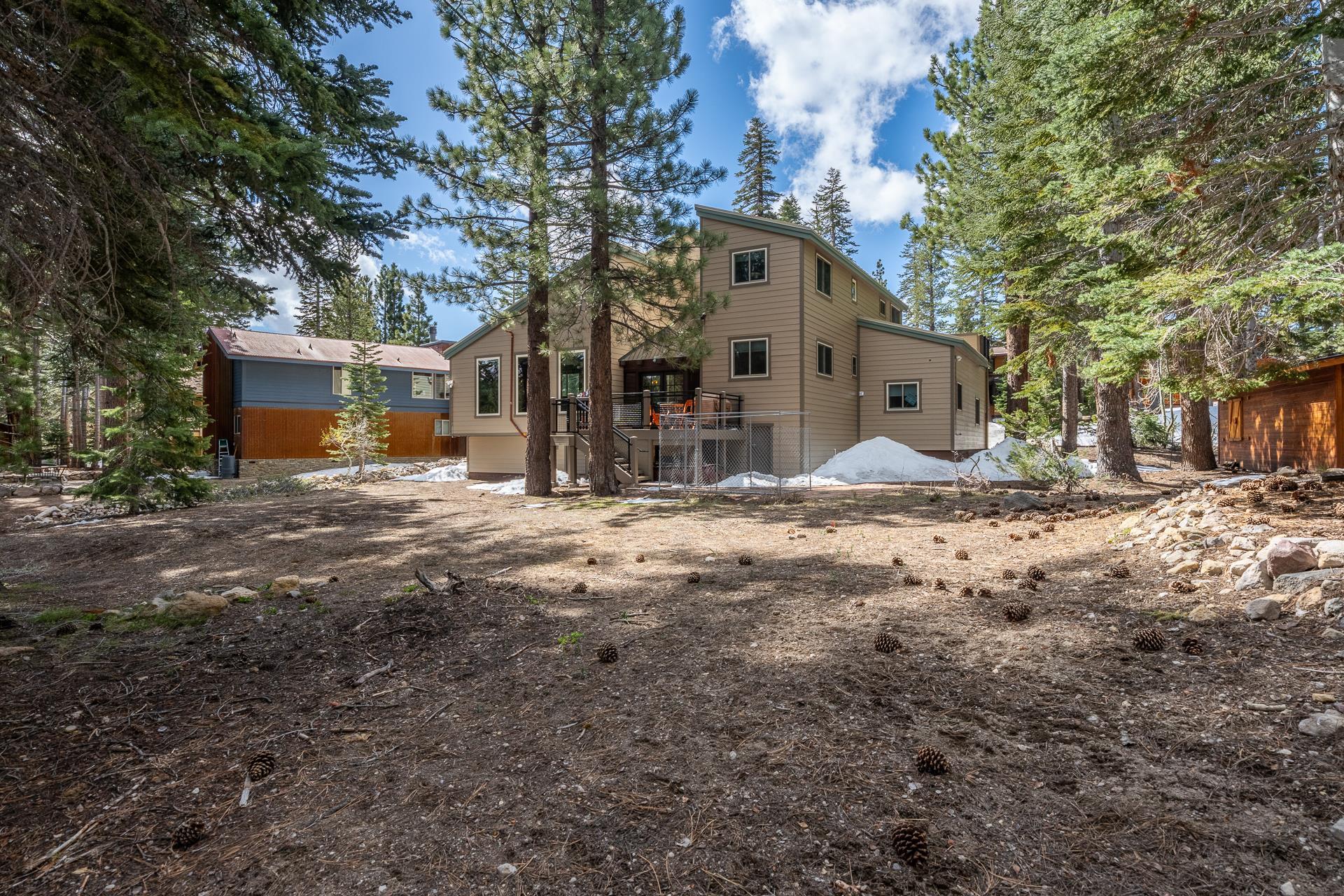 139 Ridgecrest Drive Mammoth Lakes, CA 93546 - Photo 62 of 65 Expansive lot featuring mature pine trees, natural ground cover, and a multi-level deck