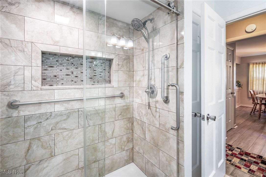 844 Roseland Road Alliance, OH 44601 - Photo 29 of 40 Bathroom featuring a shower with shower door and wood-type flooring