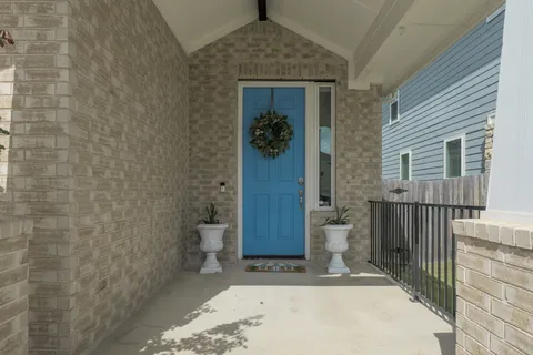 a view of a porch with wooden floor