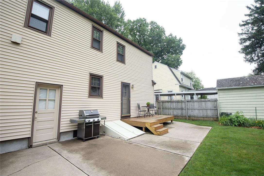 706 Stones Crossing Road Easton, PA 18045 - Photo 29 of 40 A private backyard oasis with a spacious deck and concrete patio, ideal for outdoor entertaining.