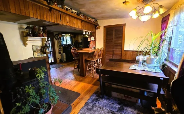 a living room with furniture a lamp and a rug