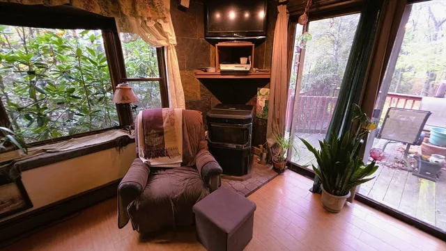 a bed sitting in a bedroom next to a window